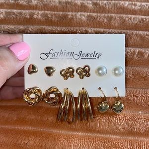 6 pairs of earrings. 4 studs and 2 small hoop earrings